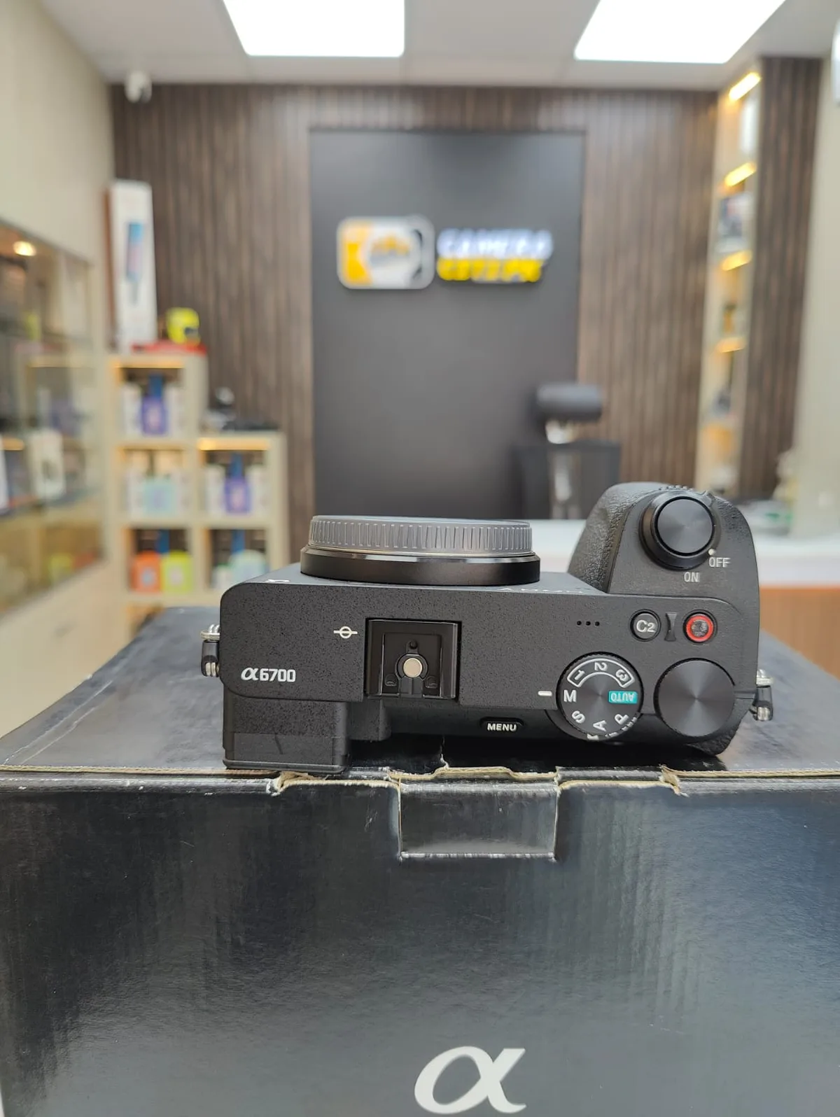 Top plate of my Sony a6700 showing the mode dial and hot shoe