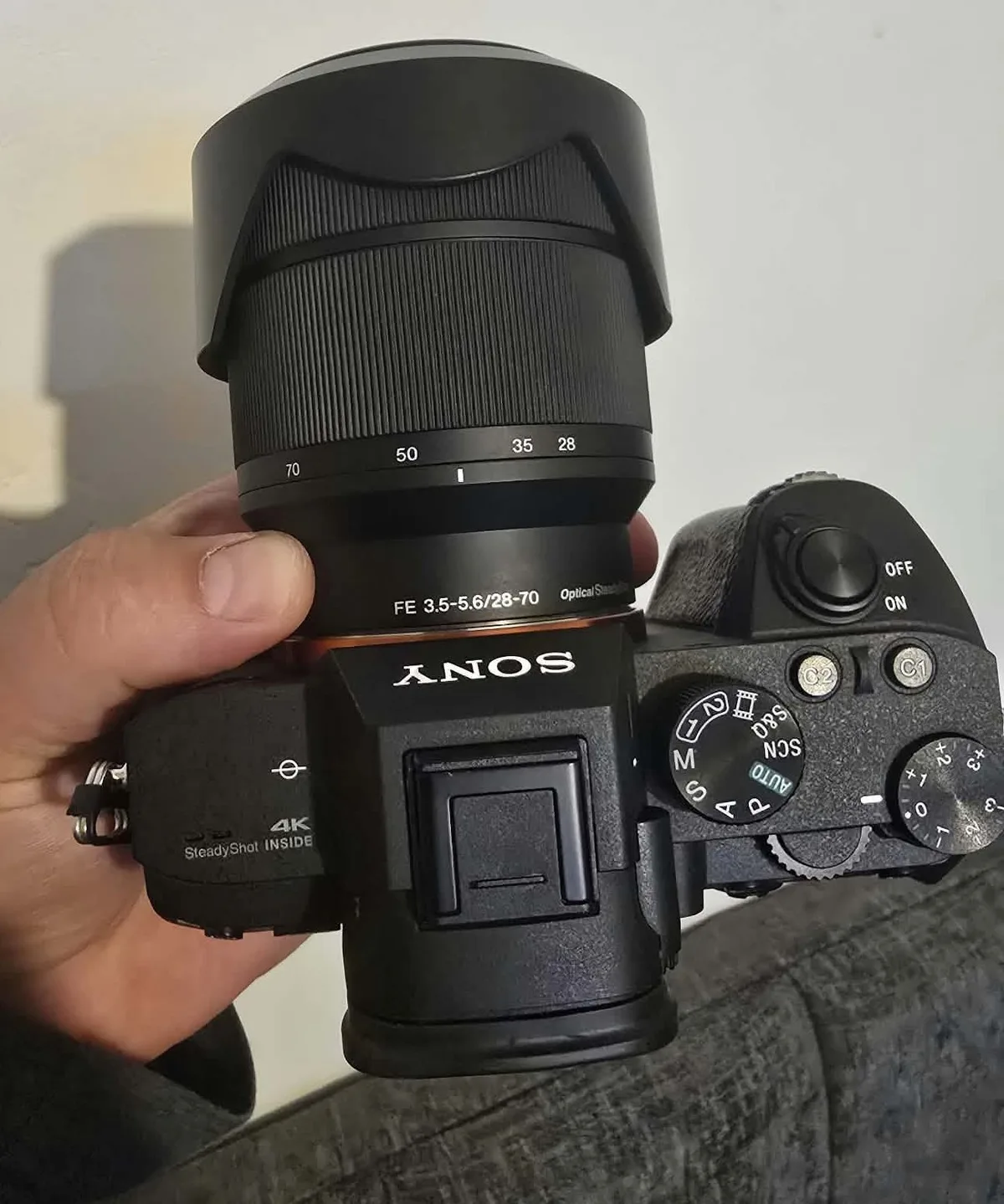 My Sony A7 III with the FE 28-70mm lens, held in hand from above